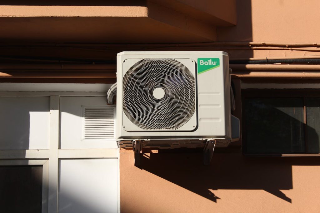 service technician repairing indoor ac system