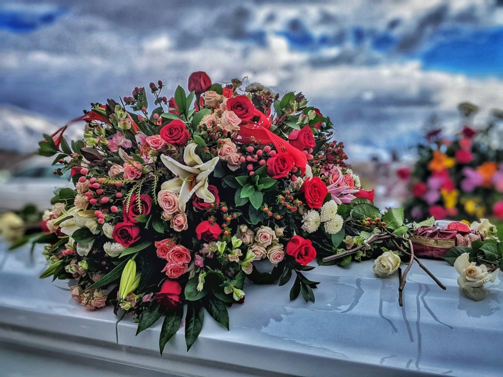 Coffin spray arranged with fresh flowers for a funeral