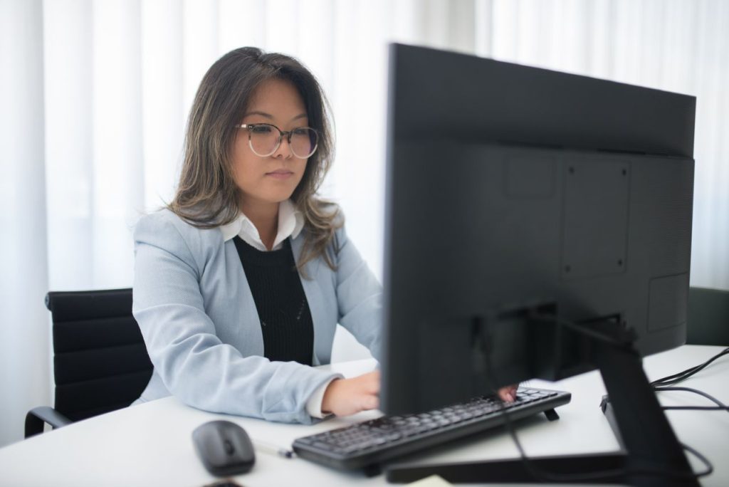 Business team accessing shared information through connected workplace systems